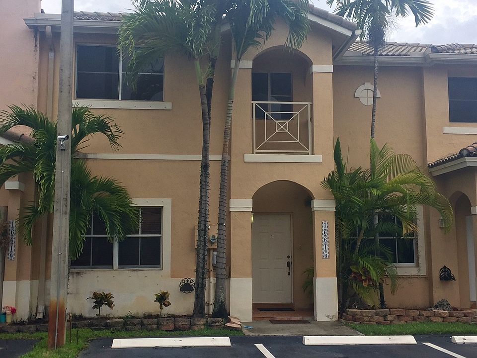 Exterior photo (2 assigned spaces in front of unit)