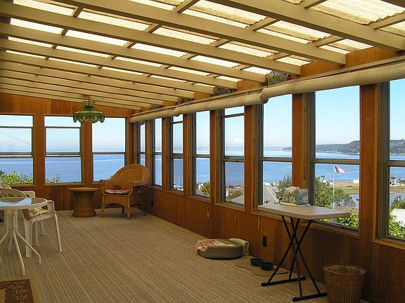 Sun Porch with view of Strait of Juan de Fuca in background.