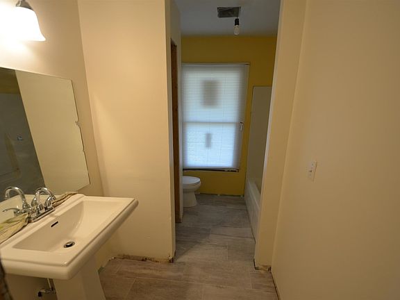 Master bath with linen closet.