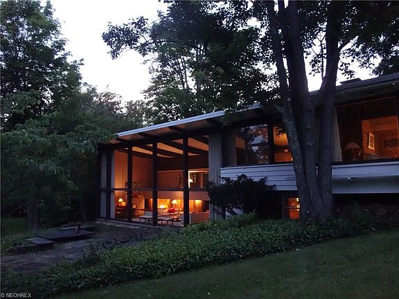 Twilight picture of home from back stone patio.