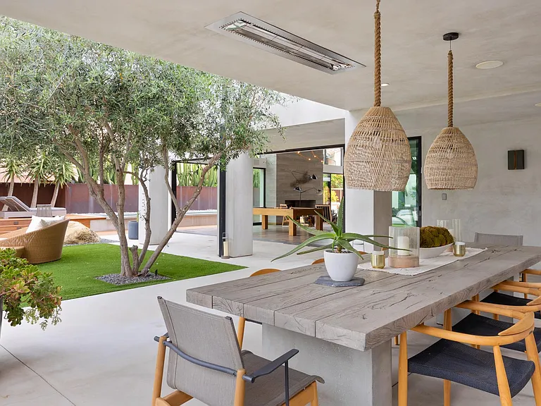Enjoy al-fresco dining at the expansive outdoor dining table.