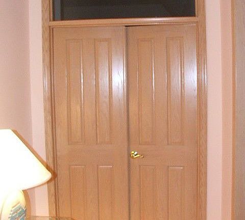 Transom window above french door entry into 1st floor master suite w fireplace