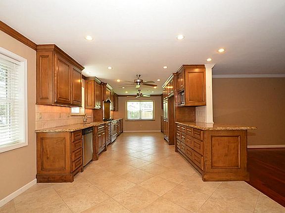 Updated Kitchen with granite counters, custom cabinetry and tile floors!