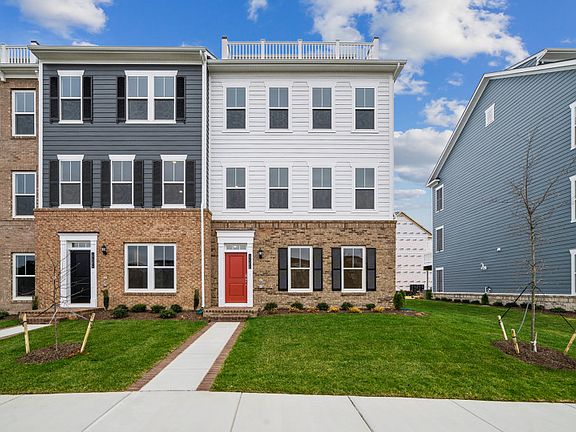 Home Exterior with Brick and Artic White Hardie Siding