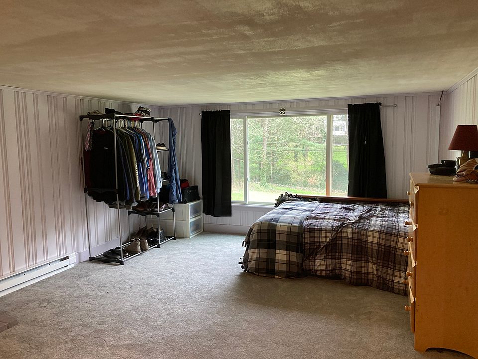Bedroom section of the apartment suite. Looks out to a backyard that backs up to a creek - which is also your backyard to enjoy.