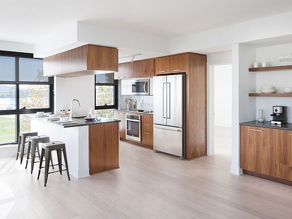 Open kitchens with sleek layouts and stainless steel appliances