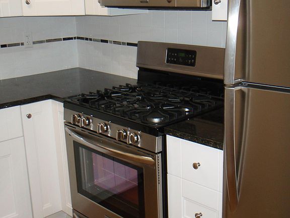 Newer cabinets, granite countertops & ceramic tile backsplash plus stainless steel appliances!