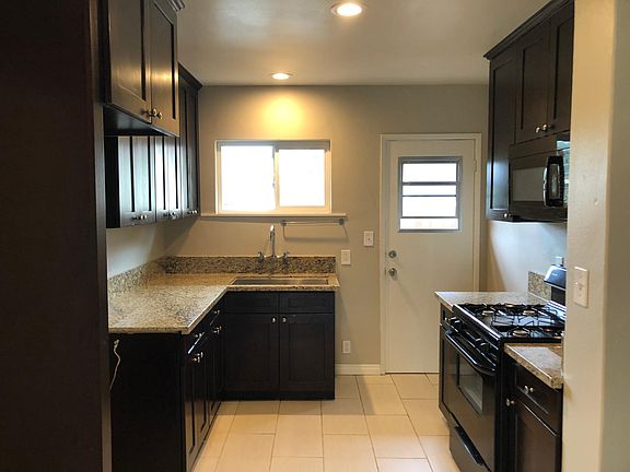 updated kitchen with stove, oven and microwave