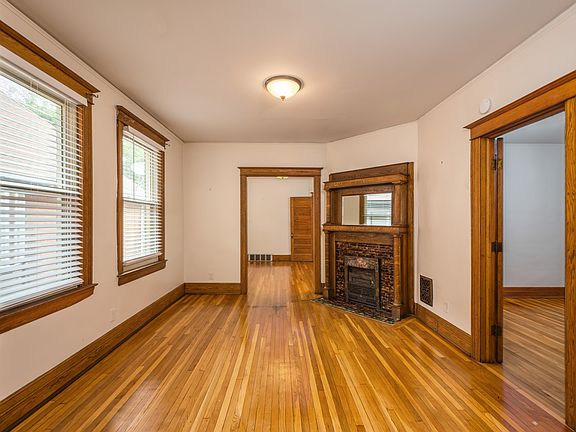 Main Entrance Room with Decorative (Only) fireplace. Bedroom 1 to right, Dining room in rear.