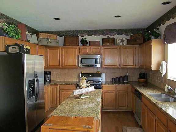  tile backsplash and lots of oak cabinets