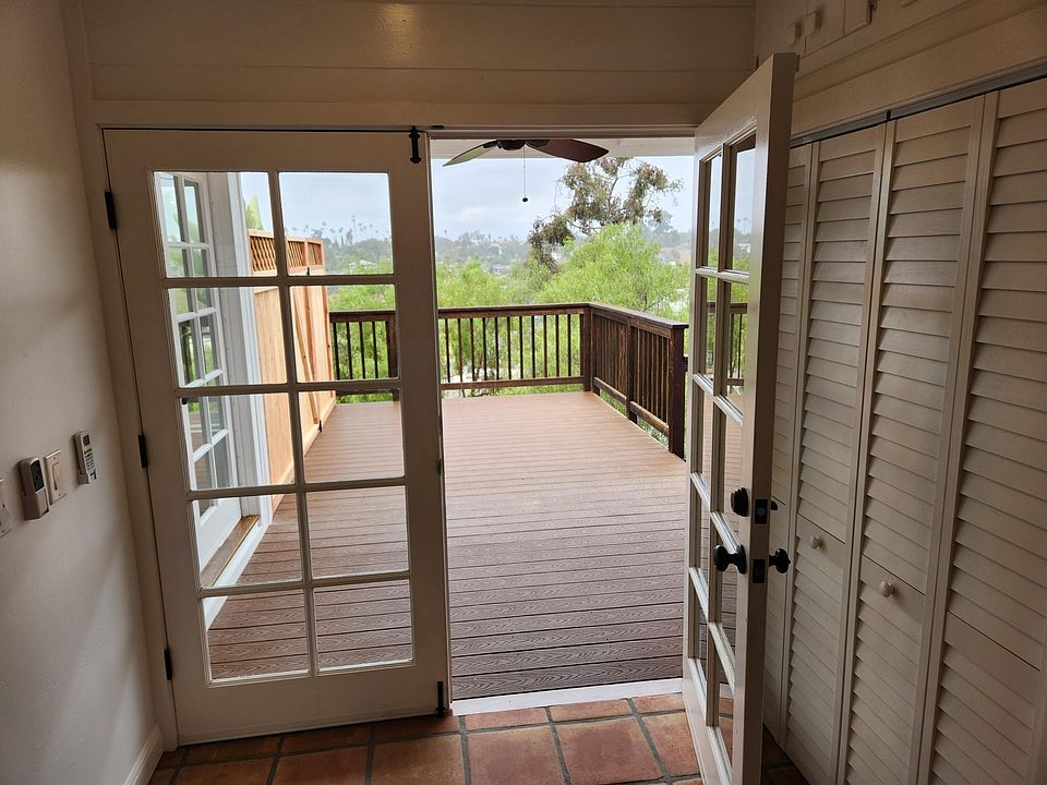 French doors leading to private deck expand living space and add character.