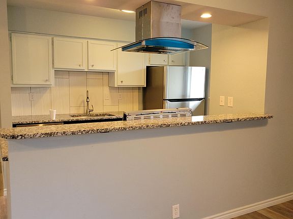 Add a few bar stools to make this a functional space to work or socialize.