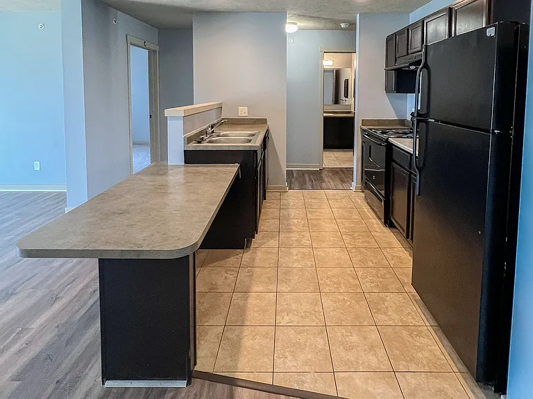 Kitchen has tile floors and includes dishwasher, full size refridgerator and stove.