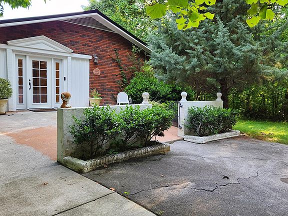 Parking and Side Entrance to House. This entrance leads directly into the newly renovated 4th BR and 3rd Bath. Great for people who have trouble with stairs.