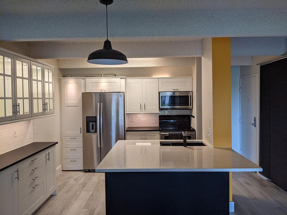 Updated kitchen with oversized quartz island.