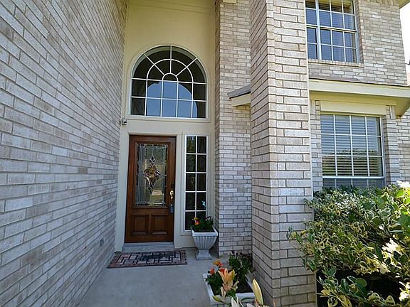 High dramatic front doorway inviting you inside.