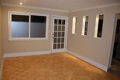 The living room includes 2/3 stained glass windows for added