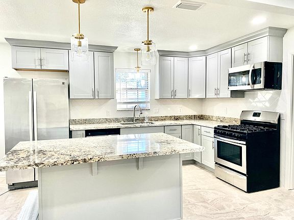 Kitchen with granite countertops. New cabinets.