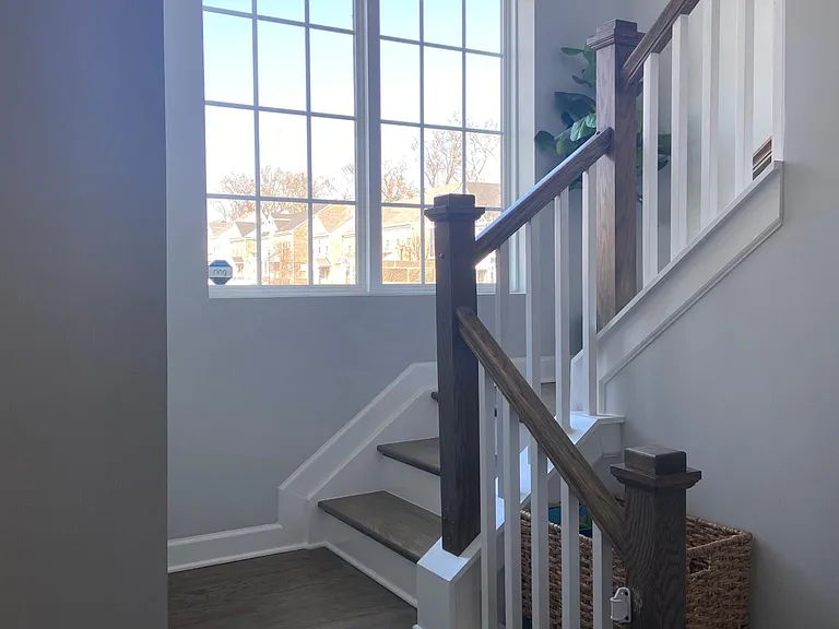 Stairwell with beautiful tall windows letting in plenty of sunshine