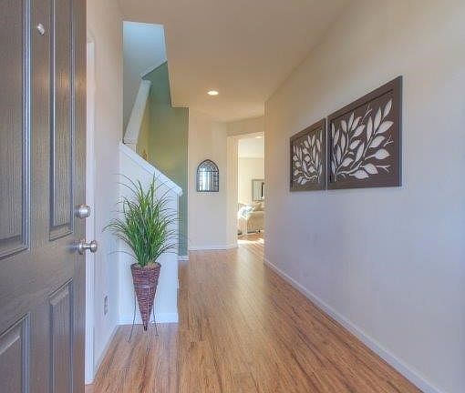 Welcoming entry.  Attractive upgraded, easy care laminate flooring throughout entire main floor. Half bath is to the left as you
