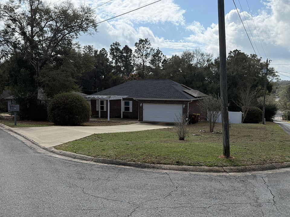 Attractive corner-lot property featuring excellent curb appeal and a charming pergola perfect for relaxing or entertaining.