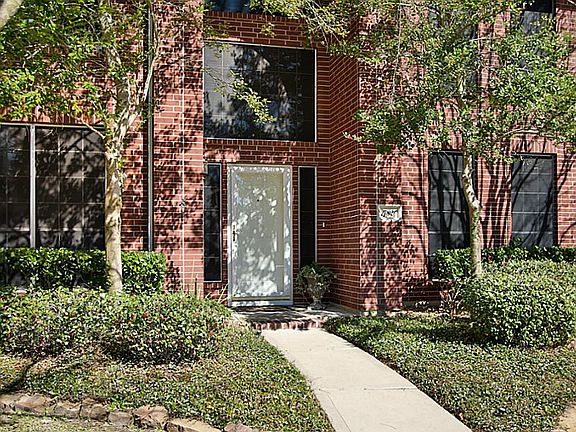Beautiful lush landscaping front and back.  Solar screens and storm doors