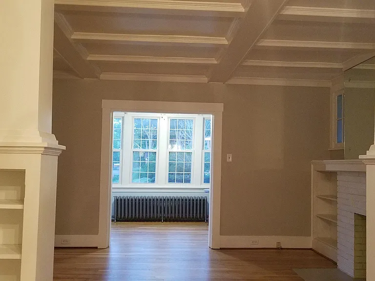 View of living room and sunroom from dining room.