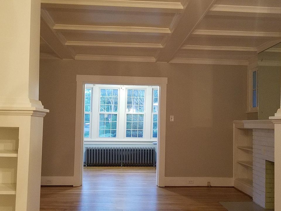View of living room and sunroom from dining room.