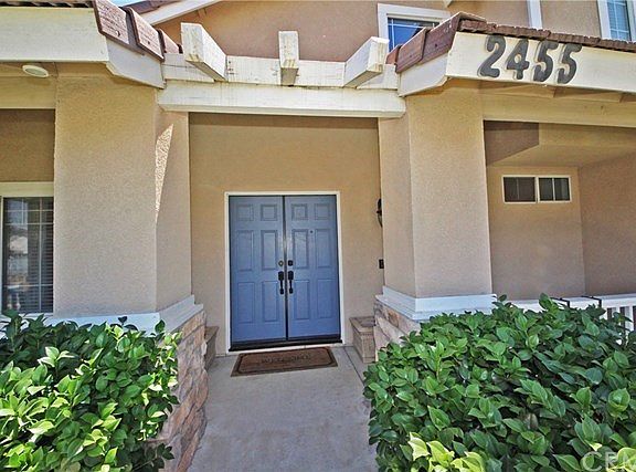 Inviting front porch with double door entryway