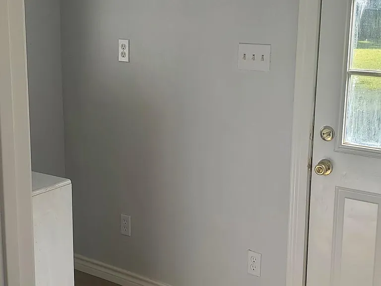 laundry room with back door to back yard