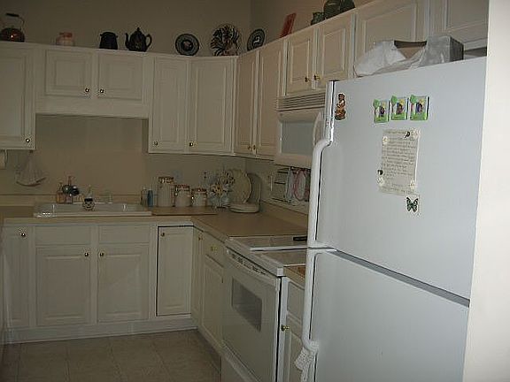 kitchen area with with cabinets and pantry