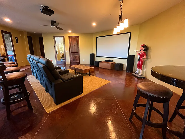 Lower Media Room with Hallway on the Left to Lower Powder Room and Master Suite 4