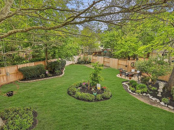 This meticulously landscaped backyard has so many features to fall in love with! It's a gardener's delight, especially that 14x11 irrigated box garden area. Fresh veggies right from the garden? Yes, please! Fence replaced in 2019.