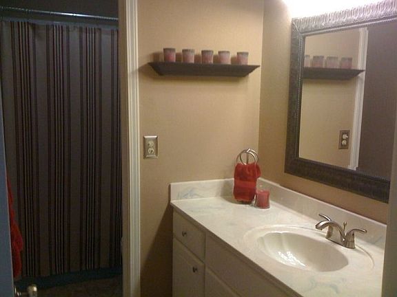 Updated light fixture, faucet, mirror and new paint!