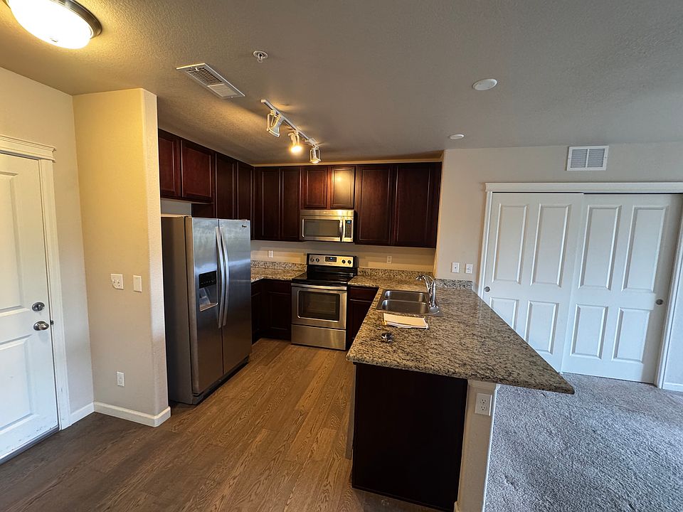 Kitchen with beautiful cabinetry opens to Living area