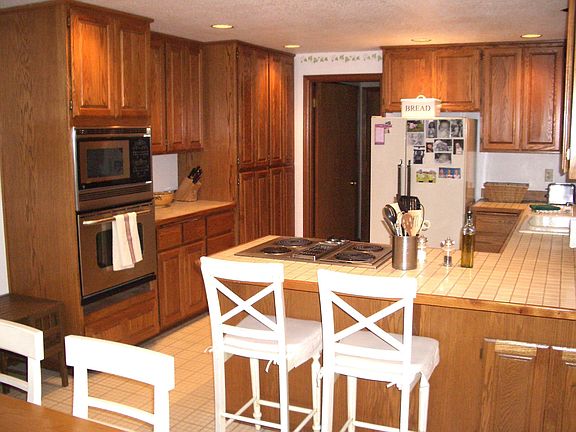 The kitchen is made for entertaining while cooking - with the bar stools and t