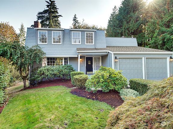 An inviting appearance with fresh exterior painting and landscaping. >