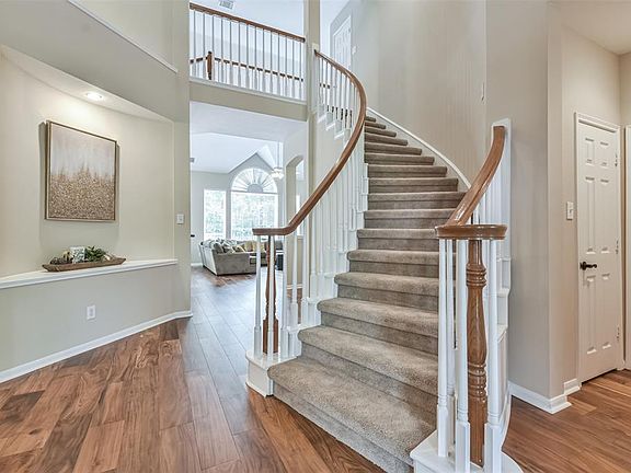 The stunning entry into the home boasts high ceilings and many windows to let in natural lights