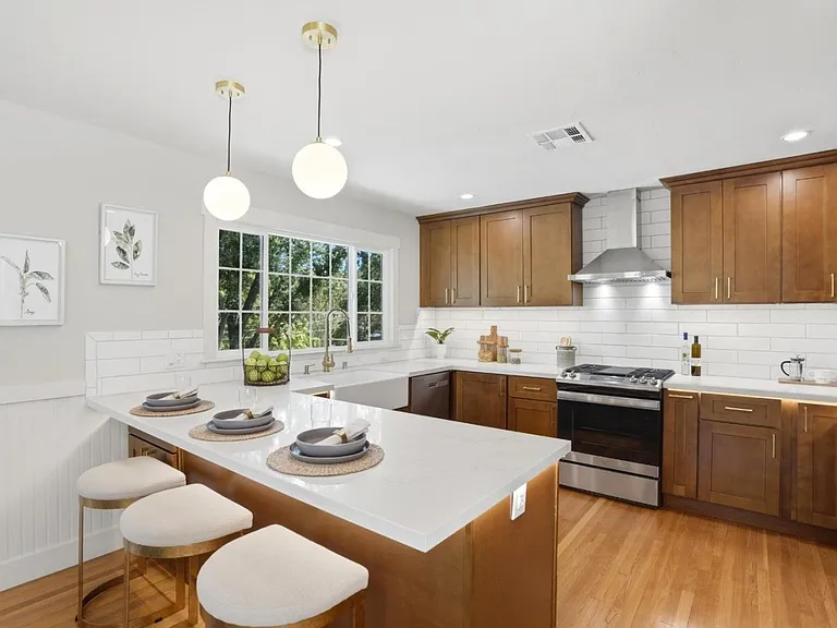 Bright chef's kitchen with oversized peninsula seating