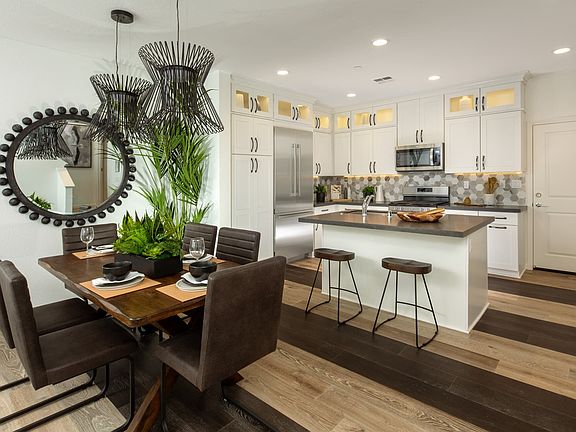 The kitchen dining room and great room are the heart of a modern, open-concept home, seamlessly blen