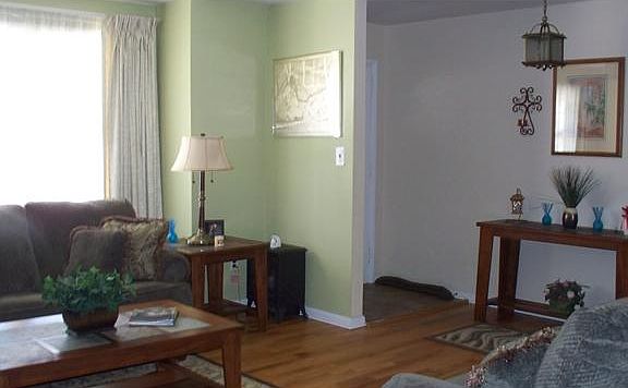 With entrance foyer open to living room