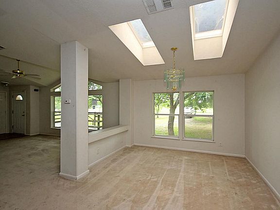 Formal dining room features skylights for added lighting!