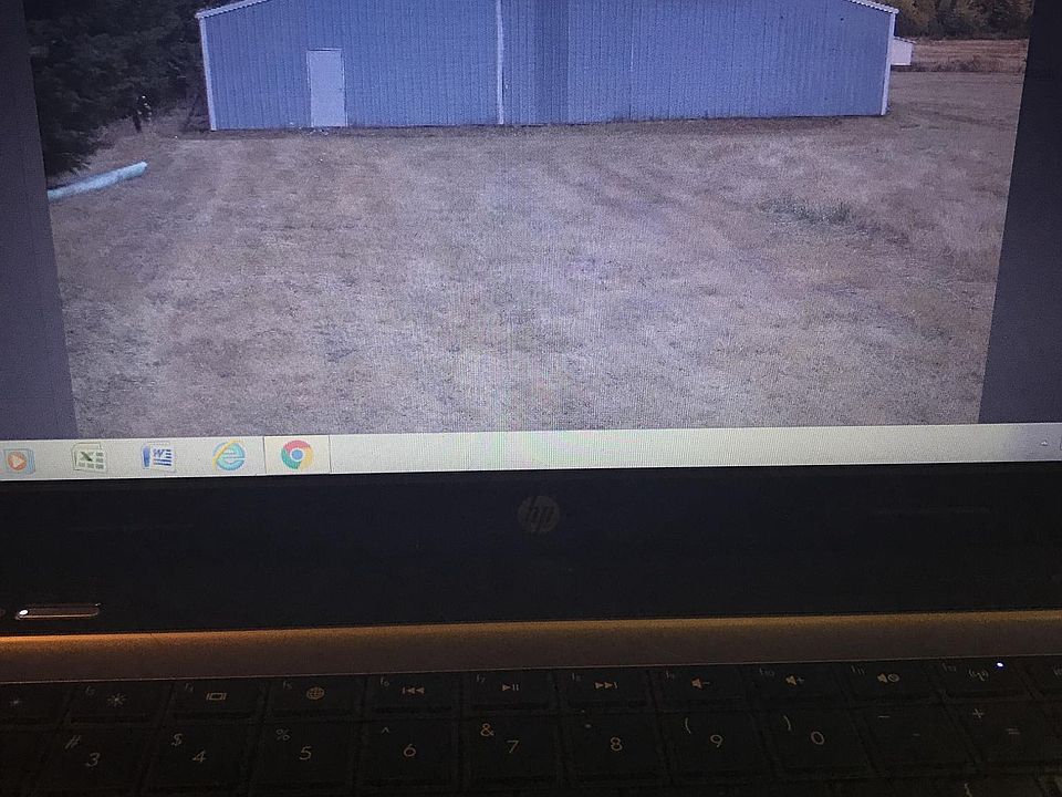 Barn (3250 sq ft), 
3 stalls room for 6 stalls, 
Tack room/ shop on concrete slab.
Electric/ Water
12' wide barn door
Indoor riding area or park your RV's, vehicles up to 50' long.
210' Gravel driveway between 7' lockable gate and barn.