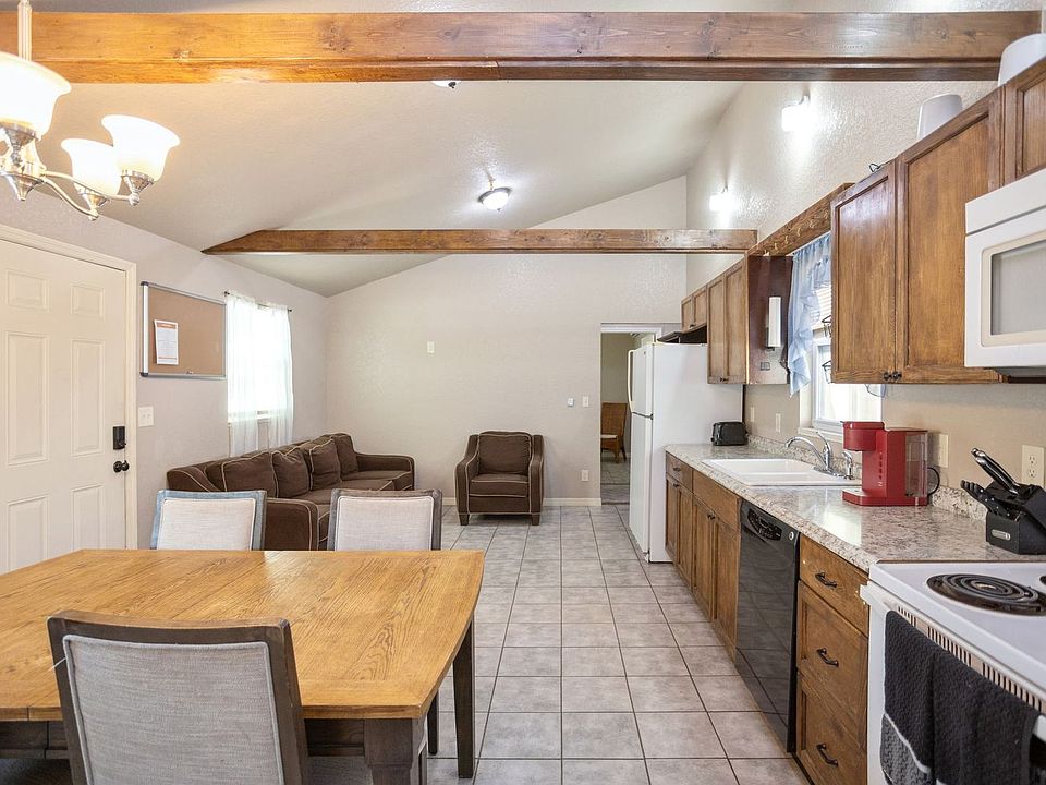 Room shares common area, which contains a full-functioning kitchen, 2 sets of tables and chairs, and a washer and dryer.