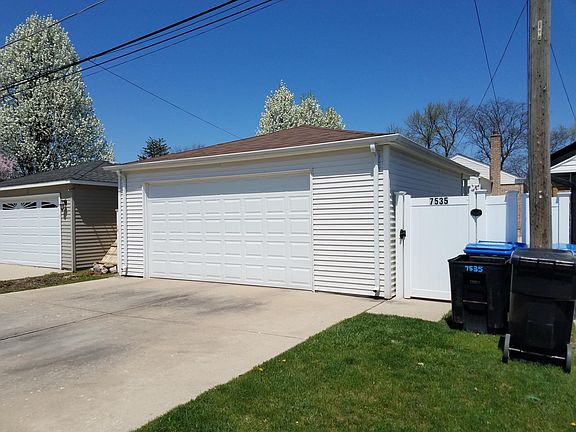 Huge garage with two overhead doors, one to driveway & one t