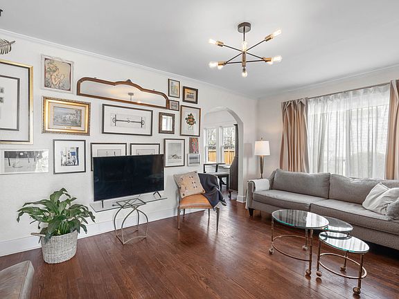 You will love hanging out in this spacious living room showered with natural light and a wood burning fireplace
