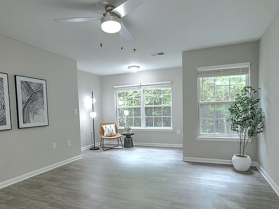 Spacious living room with a dedicated area for an at-home office or a reading nook.