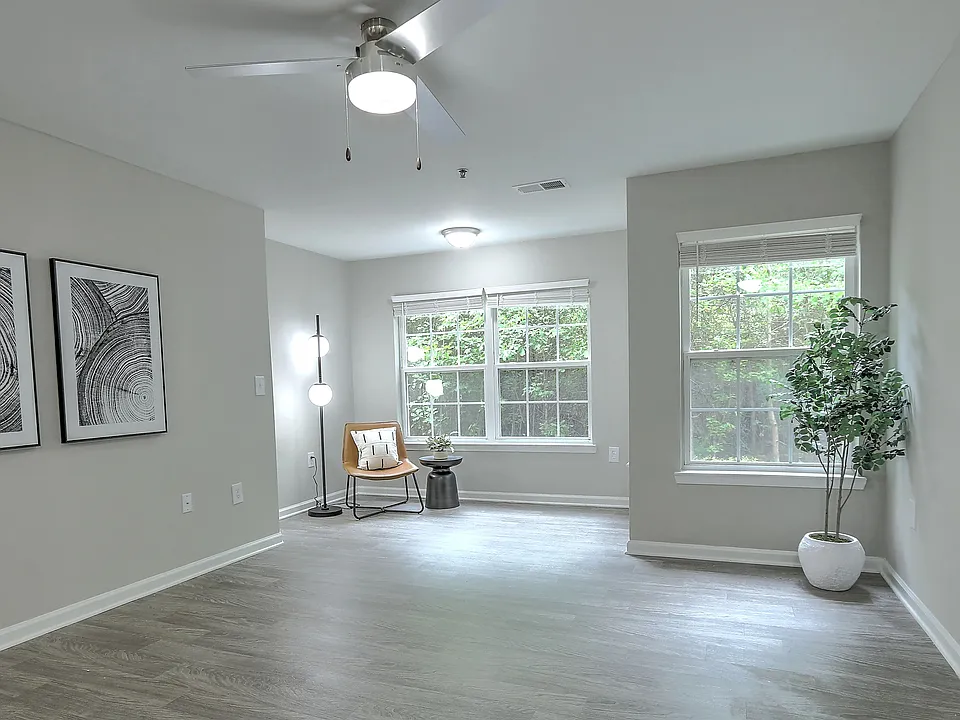Spacious living room with a dedicated area for an at-home office or a reading nook.
