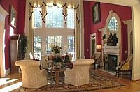 Breathtaking formal living room with twenty foot triple trey ceiling.