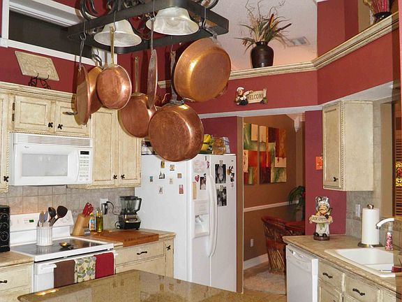 Kitchen with custom painted cabintes